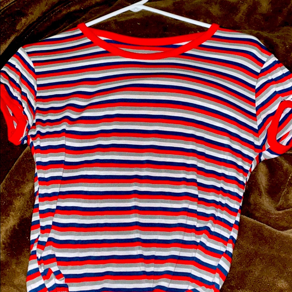 A cropped red, blue, grey, and white shirt.